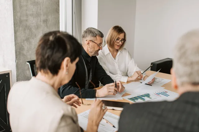 Team of professionals in office analyzing financial documents for business strategy. What staff actually ask about codes of conduct, and what it means